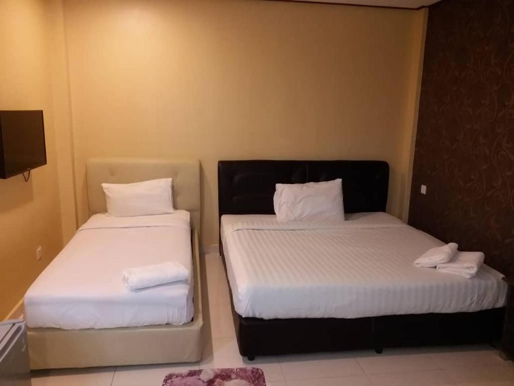 Postel nebo postele na pokoji v ubytování D lima beach inn