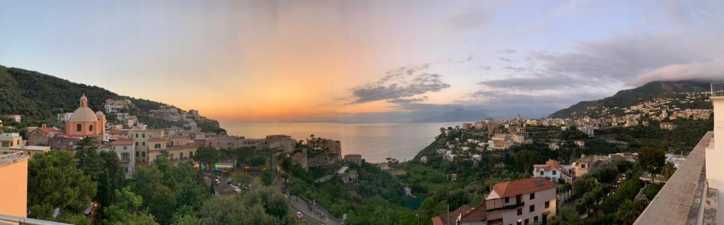 a view of a city with a rainbow in the sky at Grand Hotel Moon Valley in Vico Equense