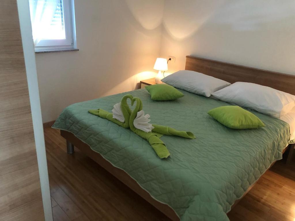 Postel nebo postele na pokoji v ubytování Apartmani Ružica