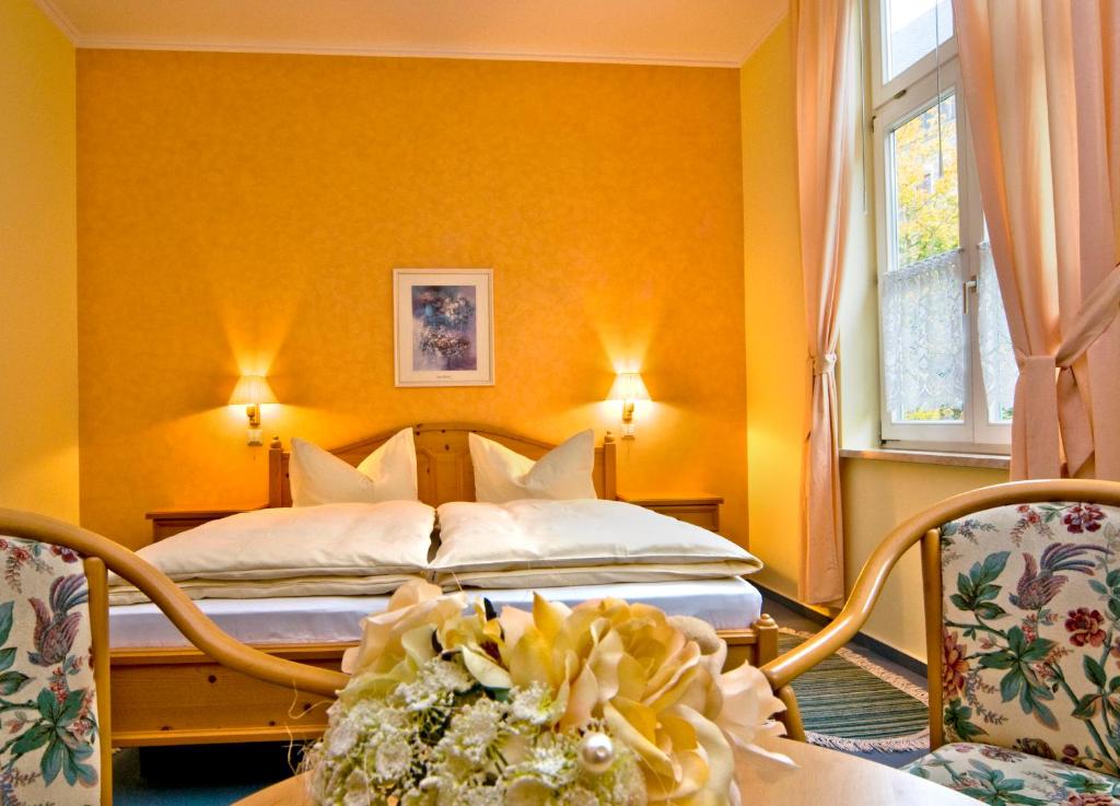 Postel nebo postele na pokoji v ubytování Hotel Am Grudenberg