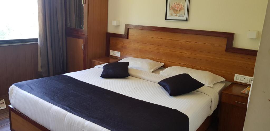 Postel nebo postele na pokoji v ubytování Bellavista Resort Munnar