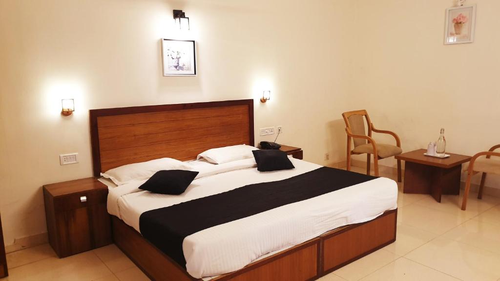 Postel nebo postele na pokoji v ubytování Bellavista Resort Munnar
