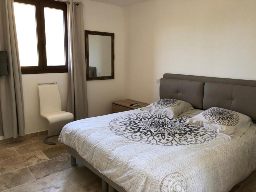 Postel nebo postele na pokoji v ubytování CHAMBRES DHOTES CORSE