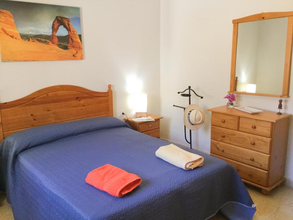 Postel nebo postele na pokoji v ubytování Casa PALMAROSA