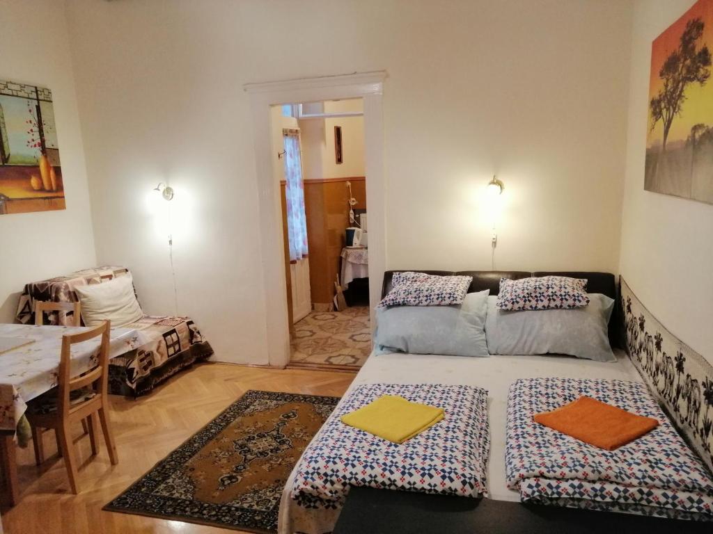 Postel nebo postele na pokoji v ubytování Garibaldi 5 Apartments & Rooms