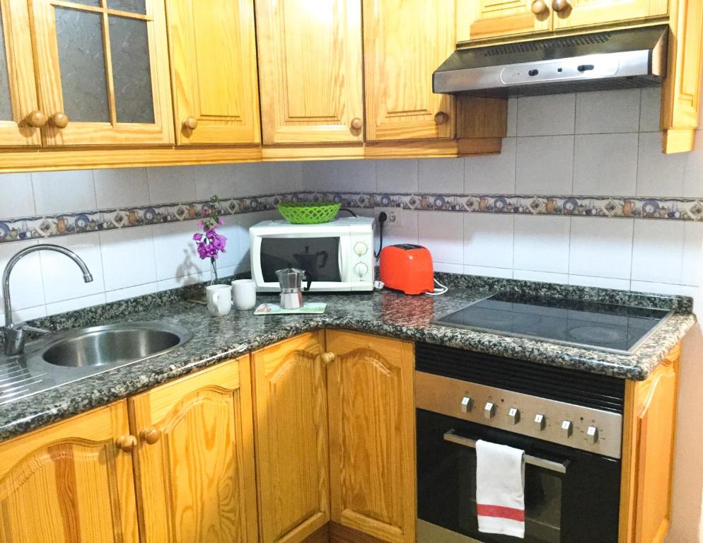 Kuchyň nebo kuchyňský kout v ubytování Casa PALMAROSA