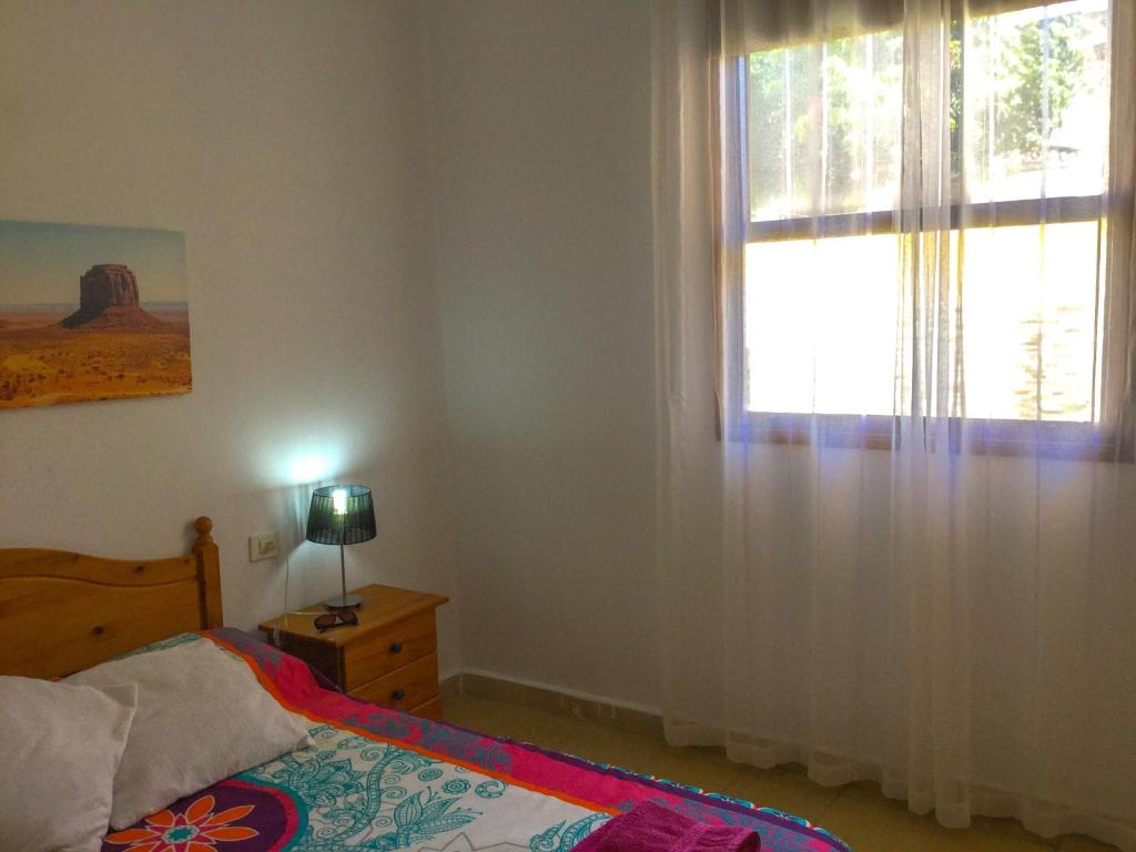 Postel nebo postele na pokoji v ubytování Casa PALMAROSA