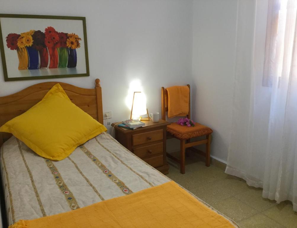 Postel nebo postele na pokoji v ubytování Casa PALMAROSA