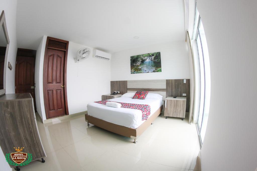 Postel nebo postele na pokoji v ubytování Hotel La Roca San Rafael