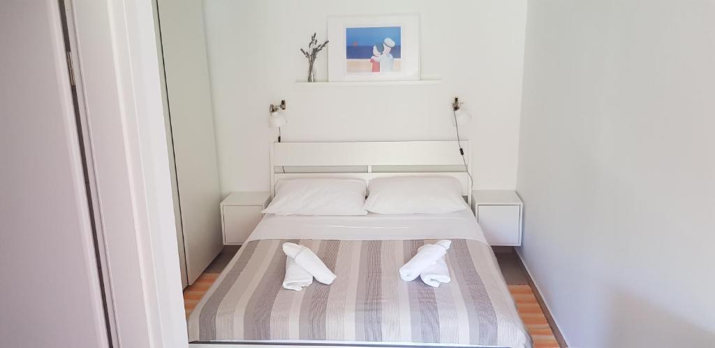 Postel nebo postele na pokoji v ubytování Apartments Vala