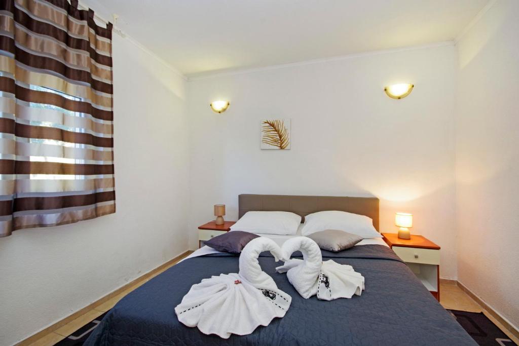 Posteľ alebo postele v izbe v ubytovaní Apartment A&J
