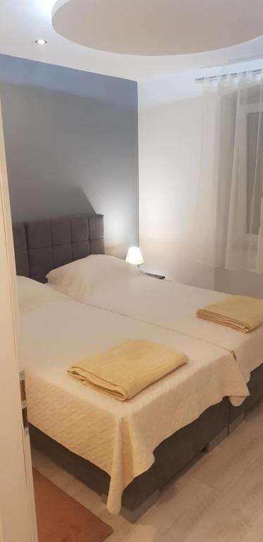 Posteľ alebo postele v izbe v ubytovaní Apartman Adriamar