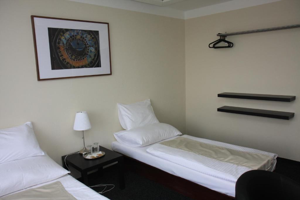 Postel nebo postele na pokoji v ubytování Retro Hotel Kladno