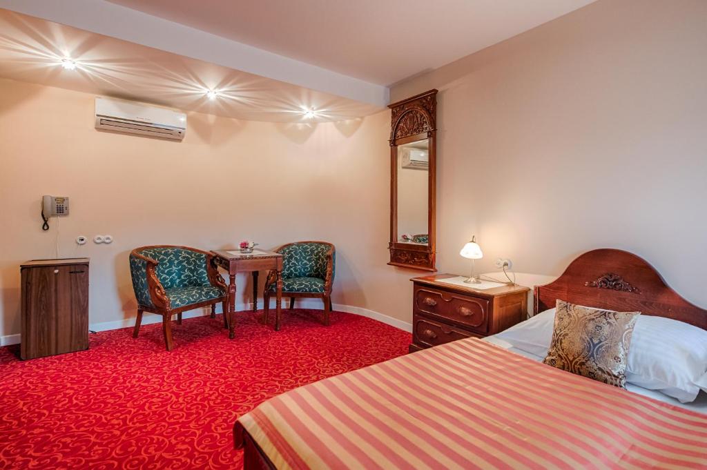 Postel nebo postele na pokoji v ubytování Hotel Zlatý Orel