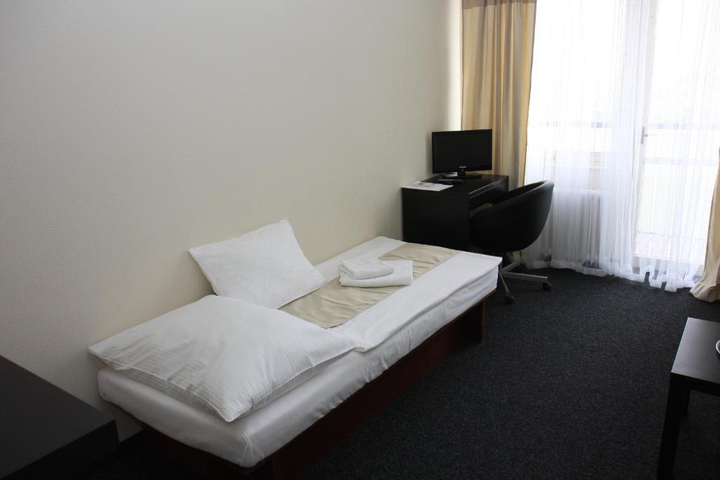 Postel nebo postele na pokoji v ubytování Retro Hotel Kladno