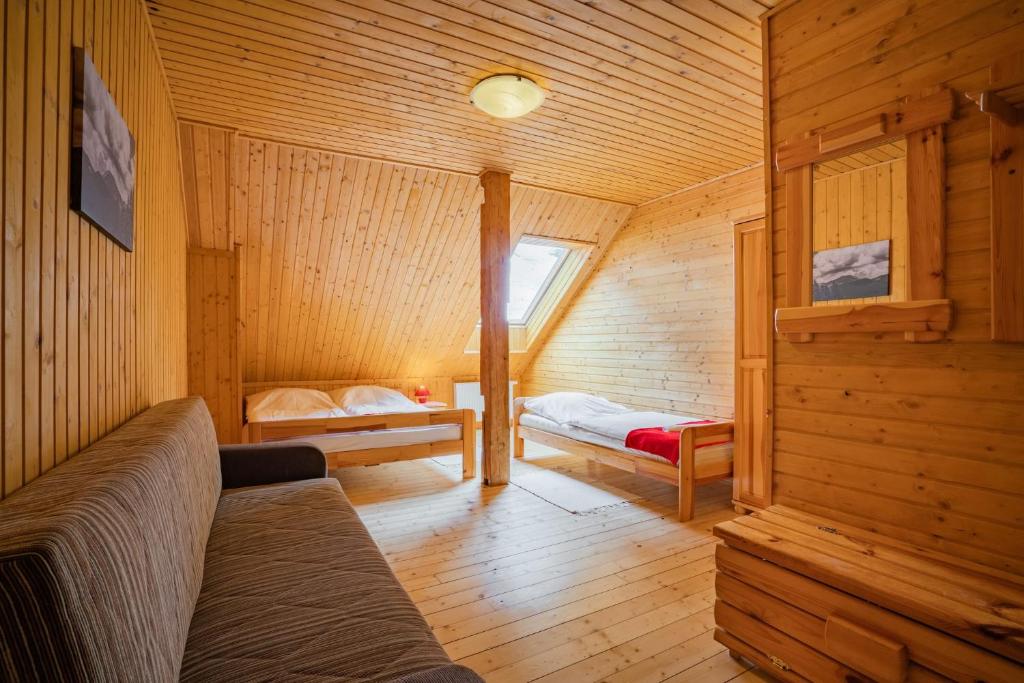 Postel nebo postele na pokoji v ubytování Chata Magurka