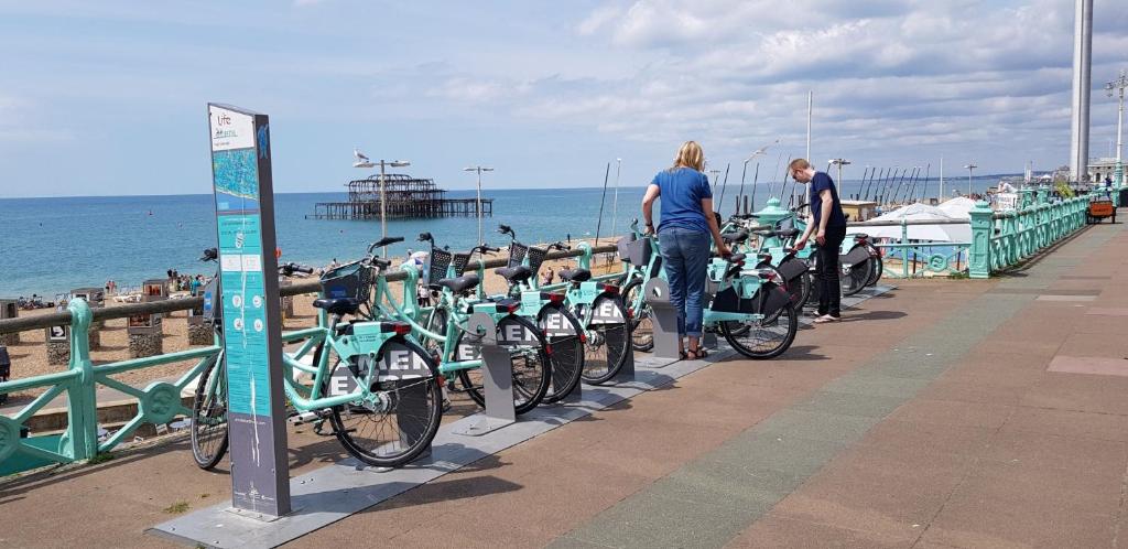 a group of bikes parked next to the beach at Andorra Guest Accommodation in Brighton & Hove
