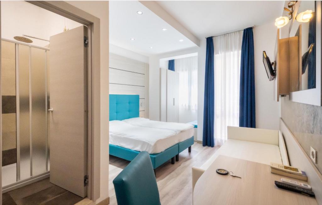 Postel nebo postele na pokoji v ubytování Hotel Gardenia