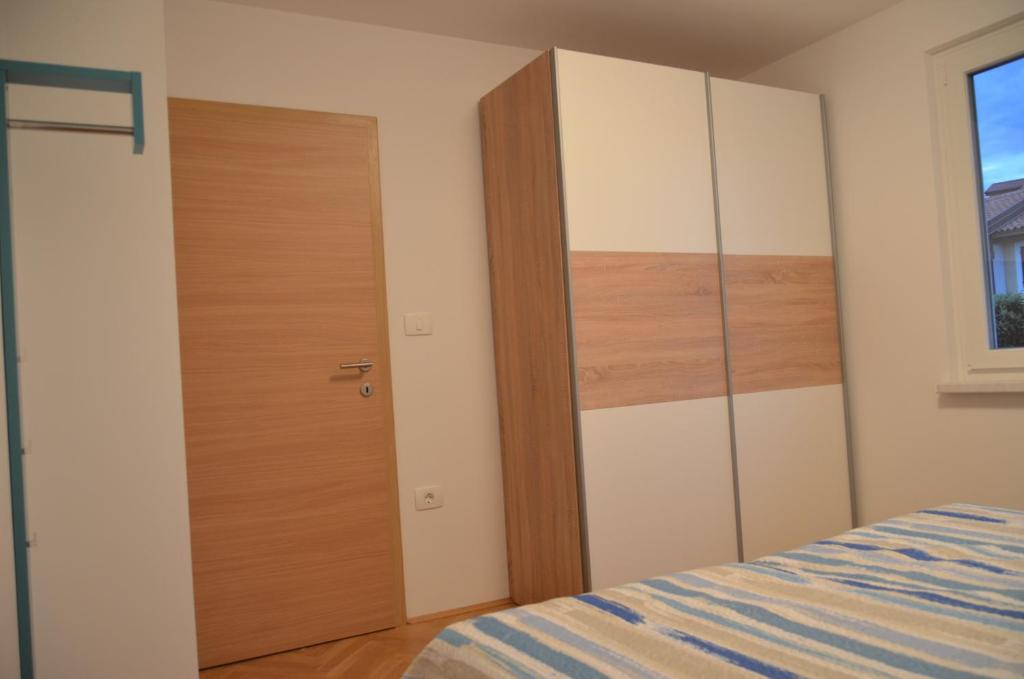Postel nebo postele na pokoji v ubytování Garden View Apartments