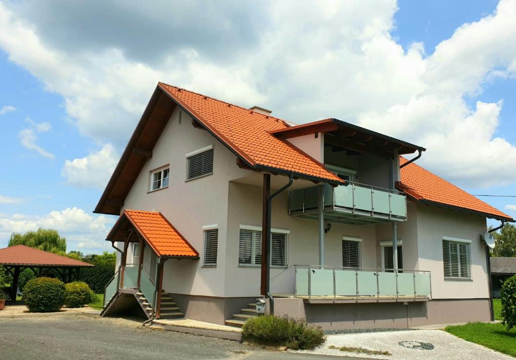a house with an orange roof at Landhaus List in Halbenrain