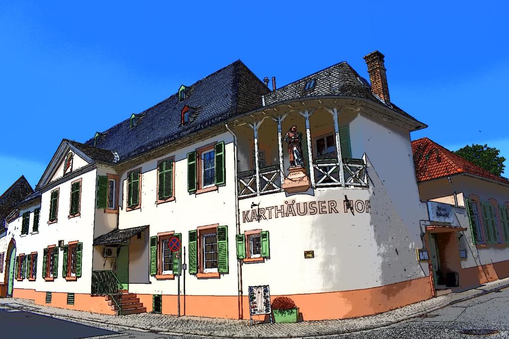 ein weißes Gebäude mit einem Schild, das das Whistler Hotel liest in der Unterkunft Hotel Karthäuser Hof in Flörsheim