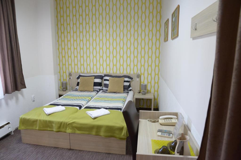 Postel nebo postele na pokoji v ubytování Guest House GOLDEN COIN