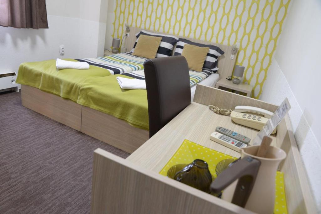 Postel nebo postele na pokoji v ubytování Guest House GOLDEN COIN