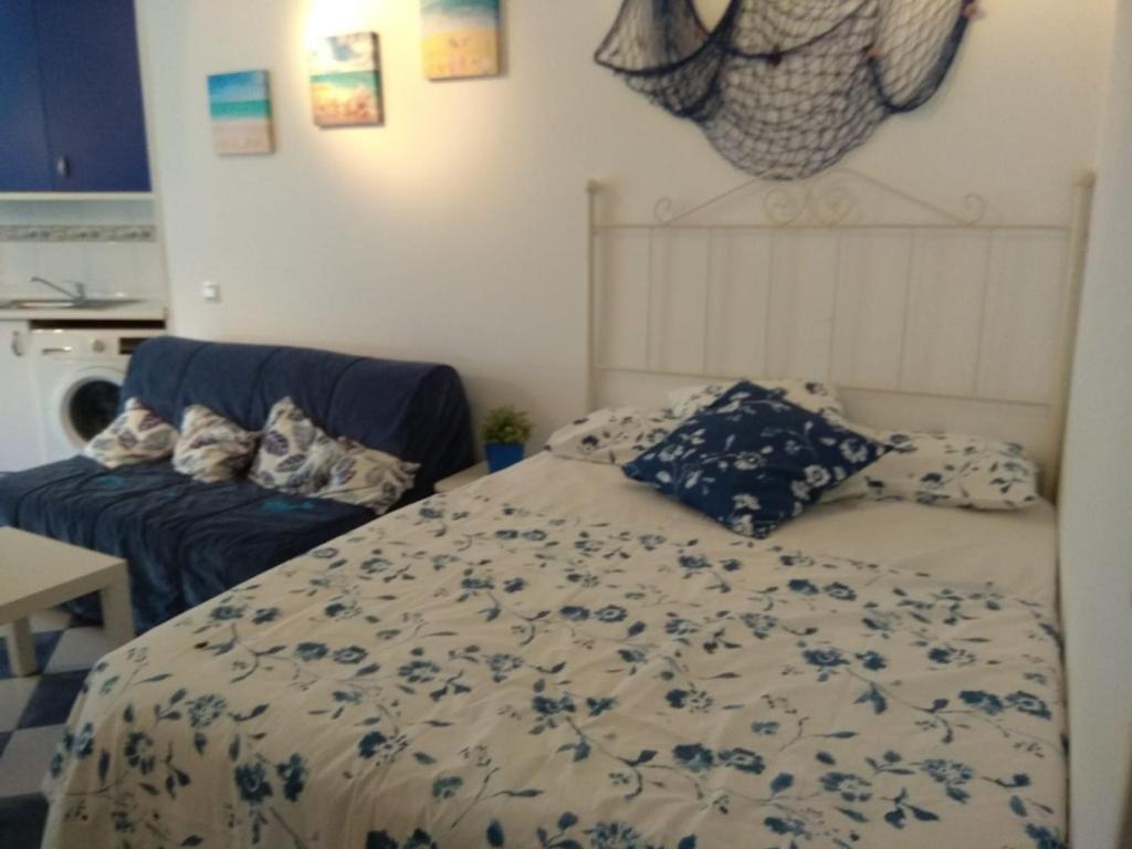 Łóżko lub łóżka w pokoju w obiekcie M3 904 Azul Mediterráneo bonito y confortable estudio