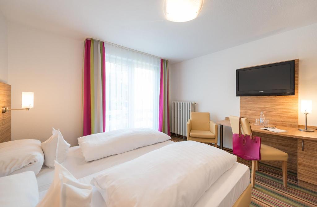 Postel nebo postele na pokoji v ubytování Hotel Haus Appel