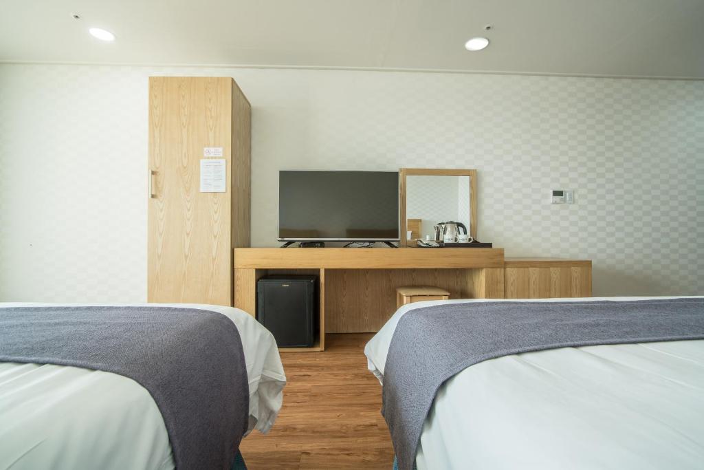 Postel nebo postele na pokoji v ubytování Breeze Bay Hotel