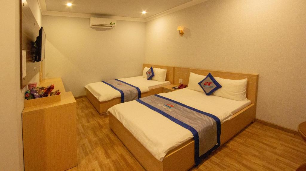 Ngoc Thanh Hotel - Queen Room Met Twee Queensize Bedden