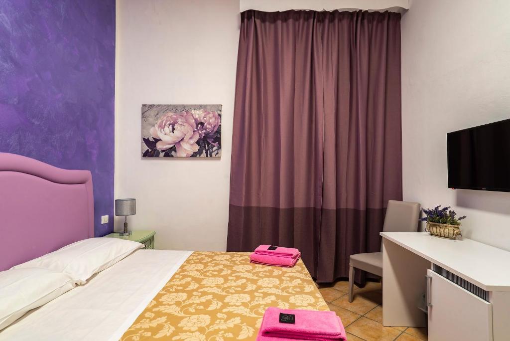 A bed or beds in a room at B&B La Cittadella
