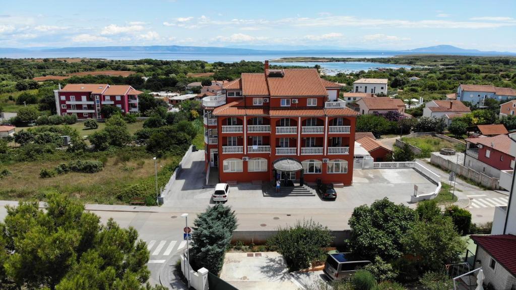 an aerial view of a large building in a town at Hotel Livadic & Restaurant in Ližnjan