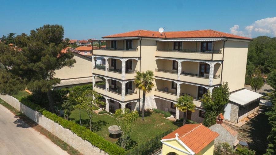 an aerial view of a house with a palm tree at Villa Julia in Lovrečica