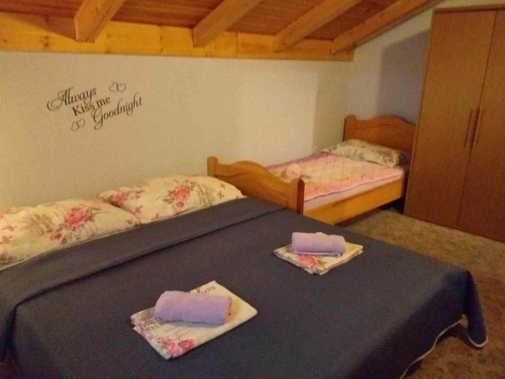 Posteľ alebo postele v izbe v ubytovaní Apartments Vidic