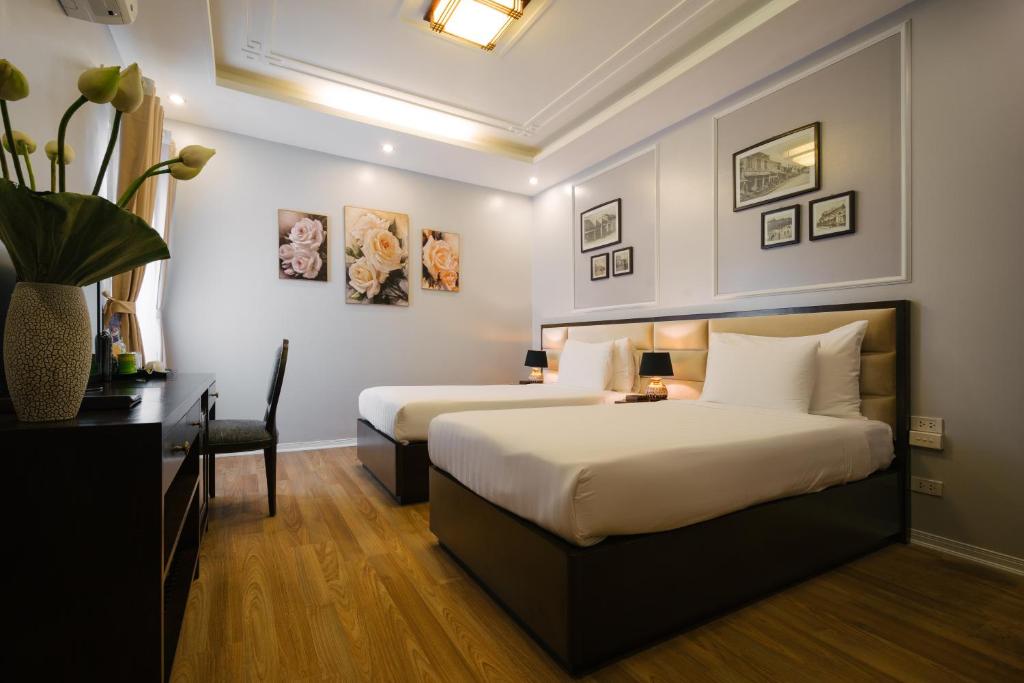 Postel nebo postele na pokoji v ubytování La Palm Hotel