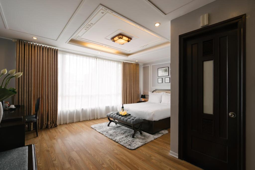 Postel nebo postele na pokoji v ubytování La Palm Hotel