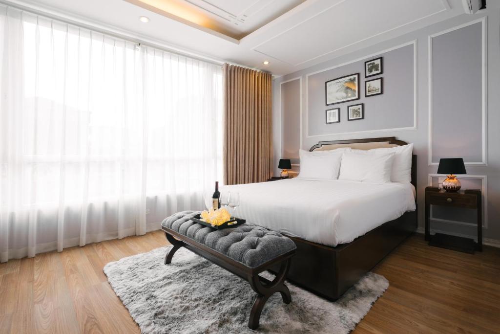 Postel nebo postele na pokoji v ubytování La Palm Hotel