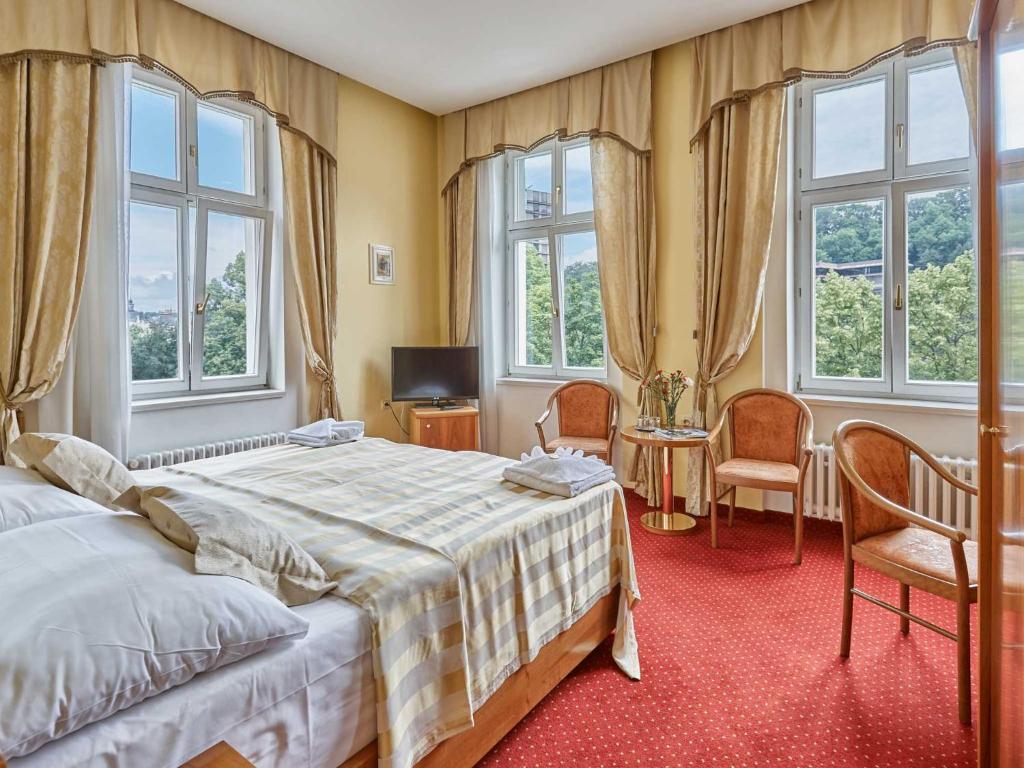 Postel nebo postele na pokoji v ubytování Hotel Sirius