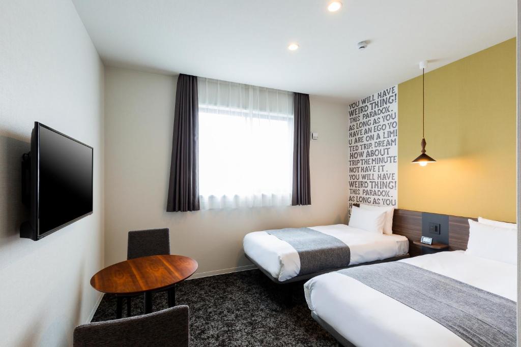 Postel nebo postele na pokoji v ubytování M's Hotel Gojo Odawara