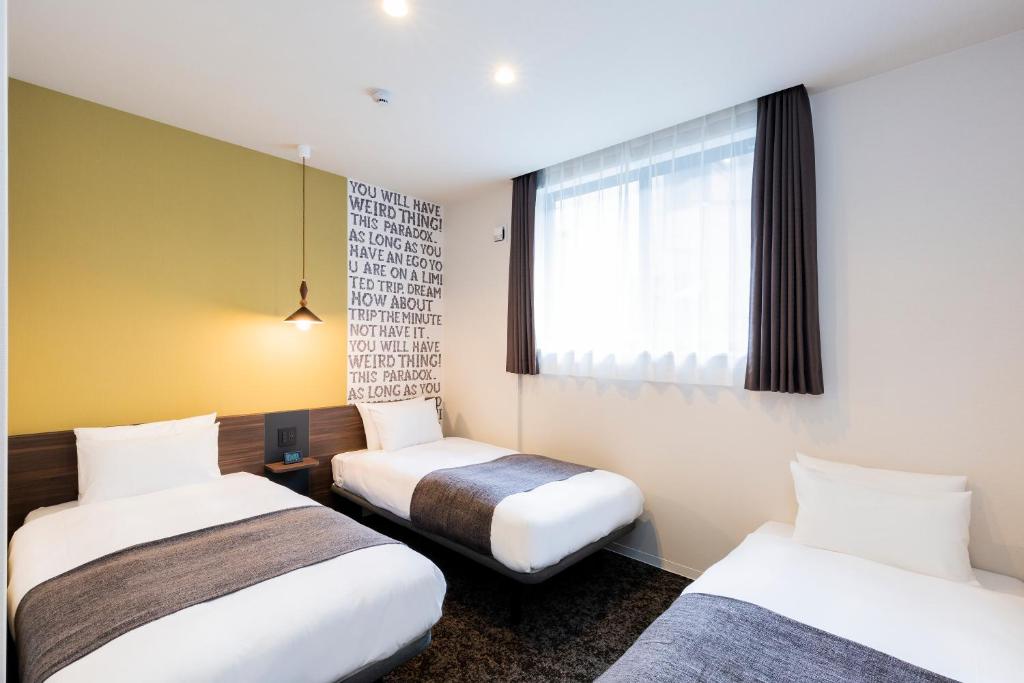 Postel nebo postele na pokoji v ubytování M's Hotel Gojo Odawara