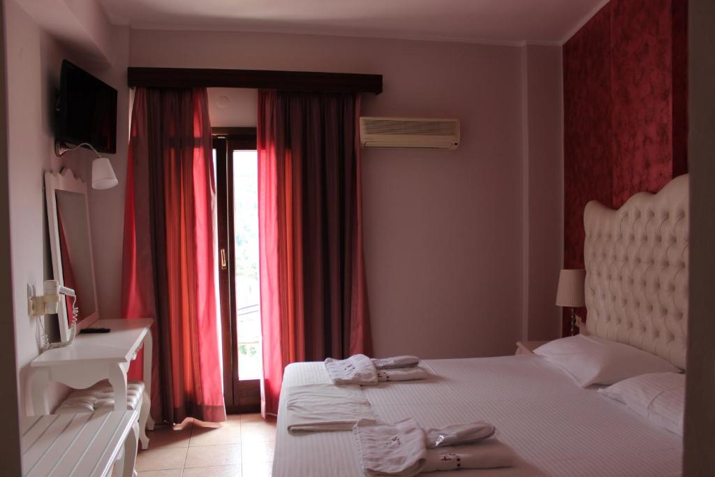 Postel nebo postele na pokoji v ubytování Palatino Hotel