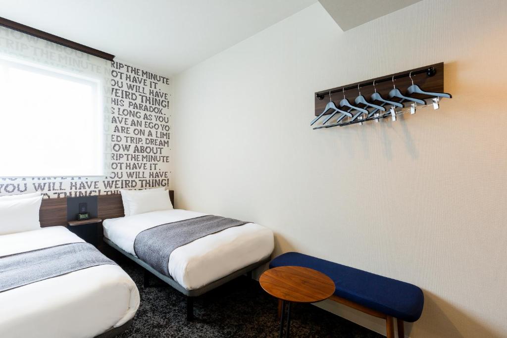 Postel nebo postele na pokoji v ubytování M's Hotel Gojo Odawara