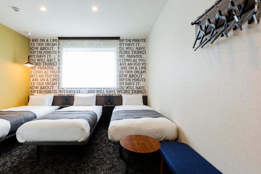 Postel nebo postele na pokoji v ubytování M's Hotel Gojo Odawara