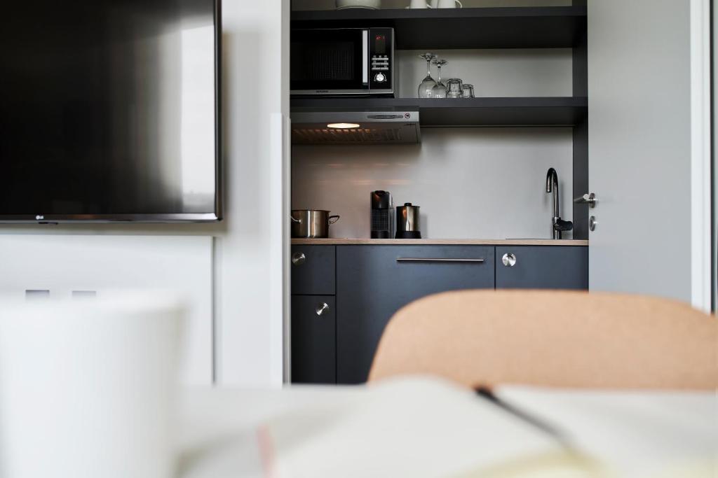Postel nebo postele na pokoji v ubytování sylc. Apartmenthotel – Serviced Apartments