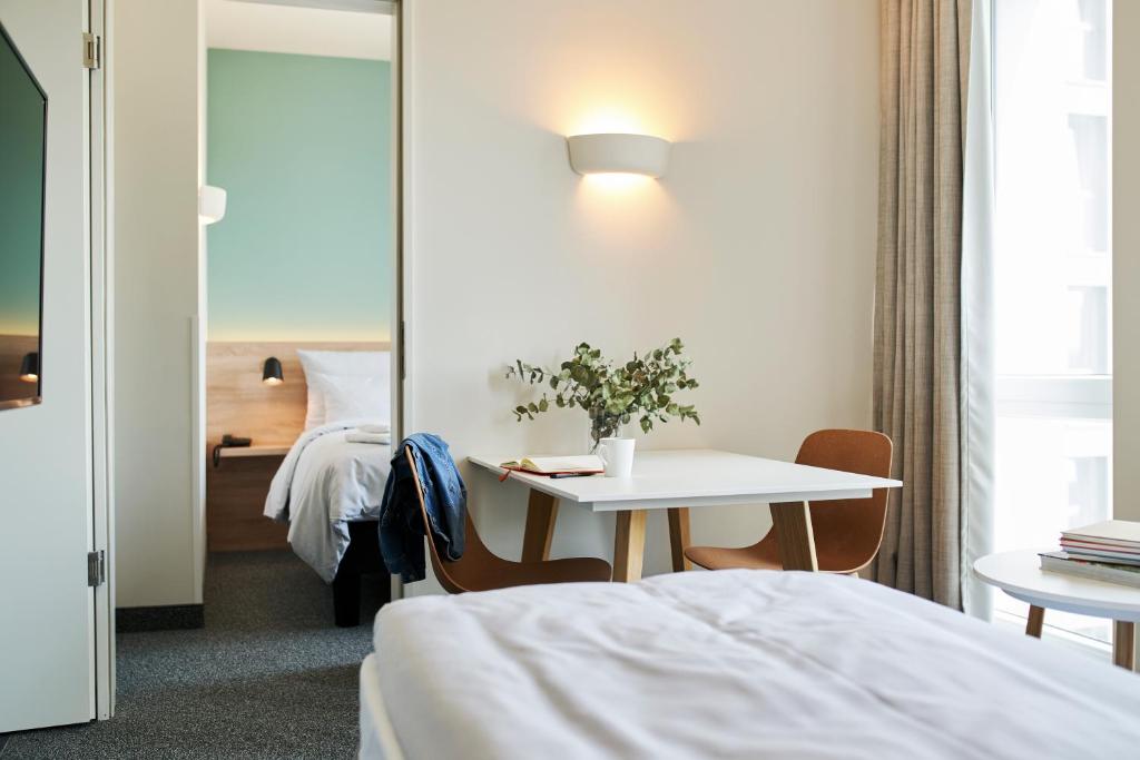 Postel nebo postele na pokoji v ubytování sylc. Apartmenthotel – Serviced Apartments