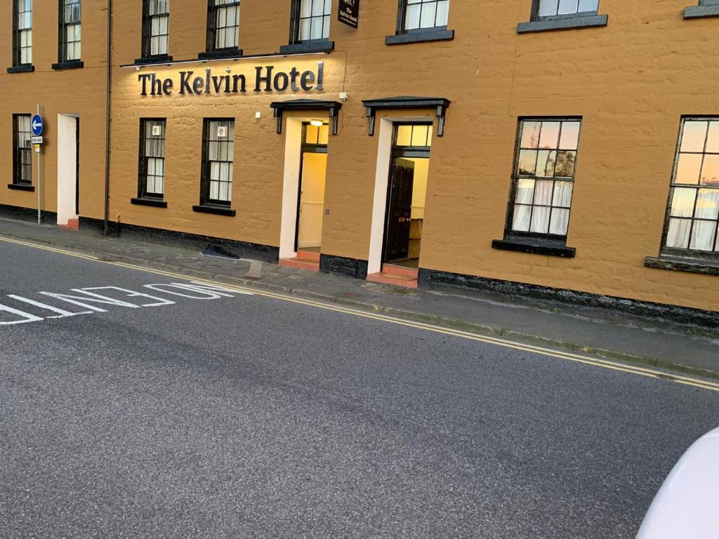 a building with the kelvin hotel on the side of a street at The Kelvin Hotel in Oban