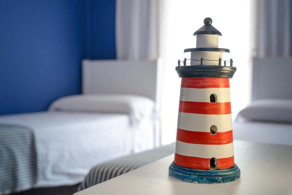 a lighthouse figurine sitting on top of a table at Port 27 in Empuriabrava