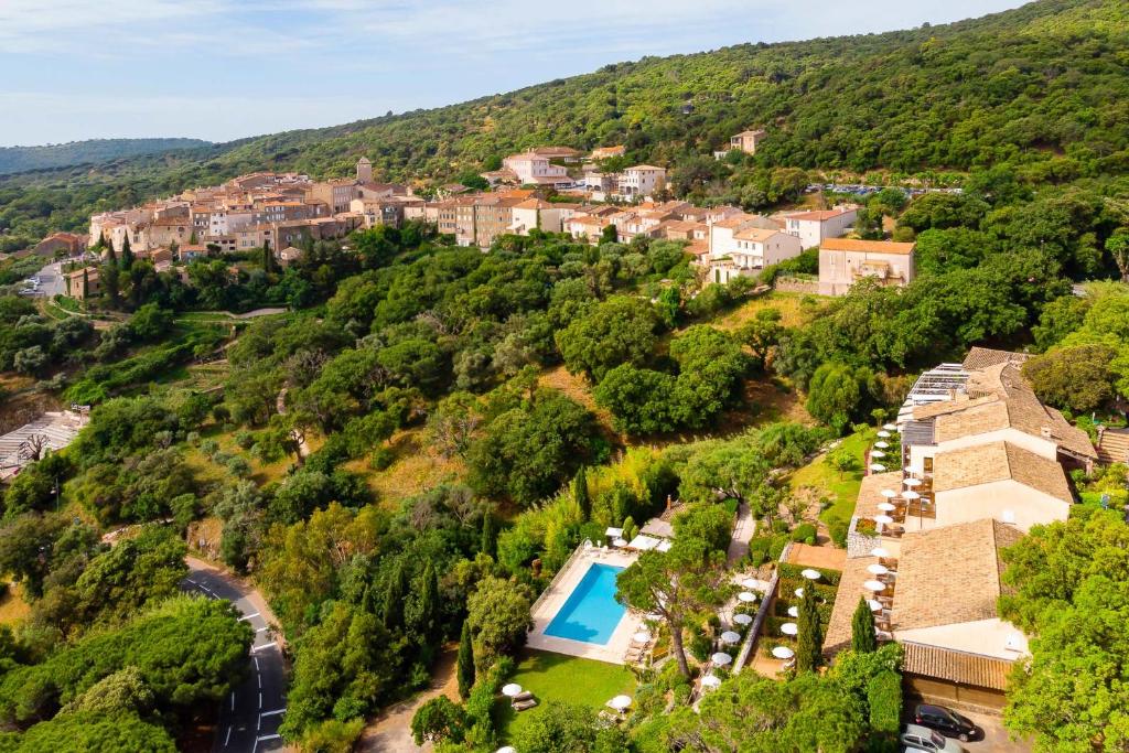 an aerial view of a villa with a resort at Hostellerie Le Baou in Ramatuelle