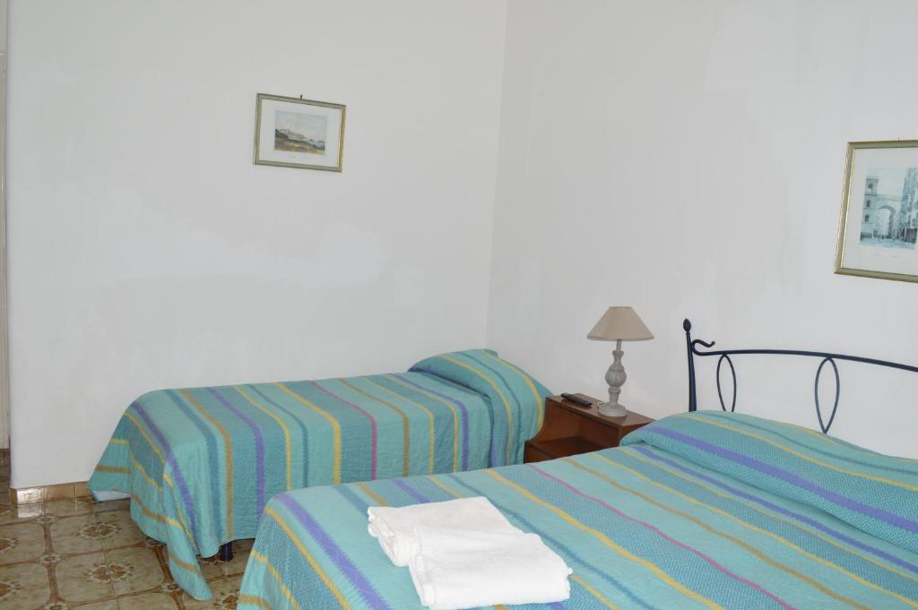 Postel nebo postele na pokoji v ubytování Hotel Polito